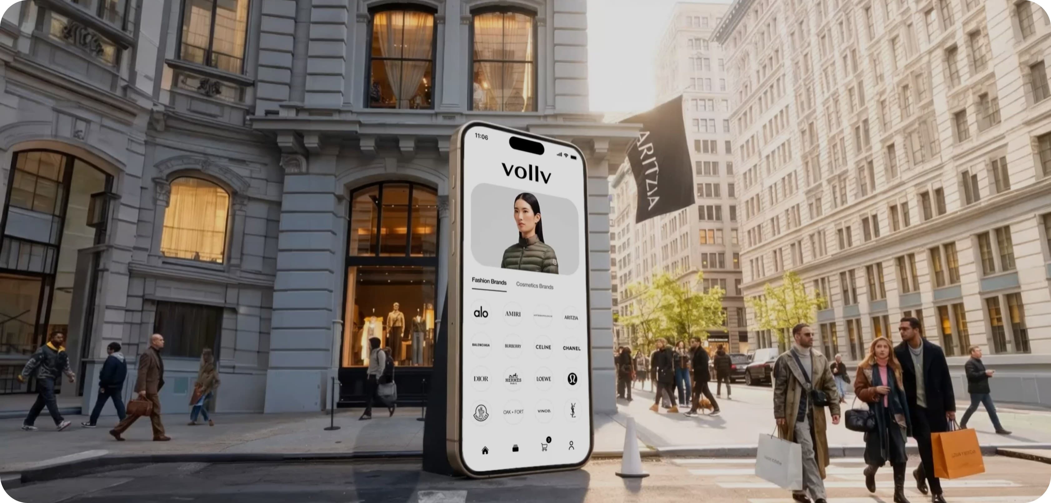 A giant phone showing the VOLLV brand feed standing on a busy shopping street